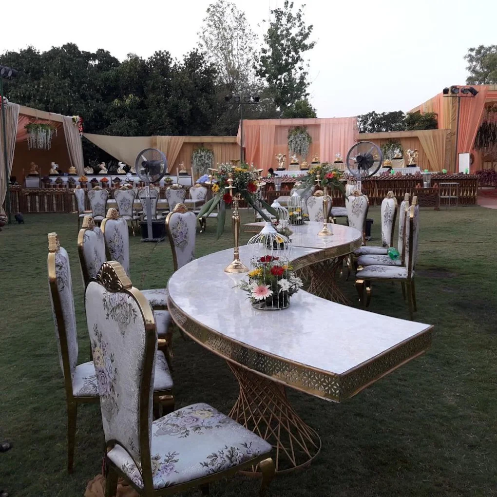 Outdoor royal dining setup with floral centerpieces