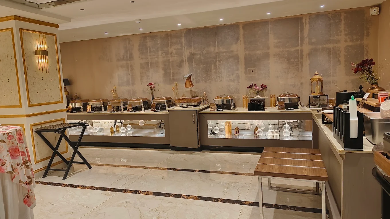 Premium indoor buffet counter with chafing dishes and gold accents